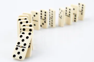 A trail of dominoes beginning to fall