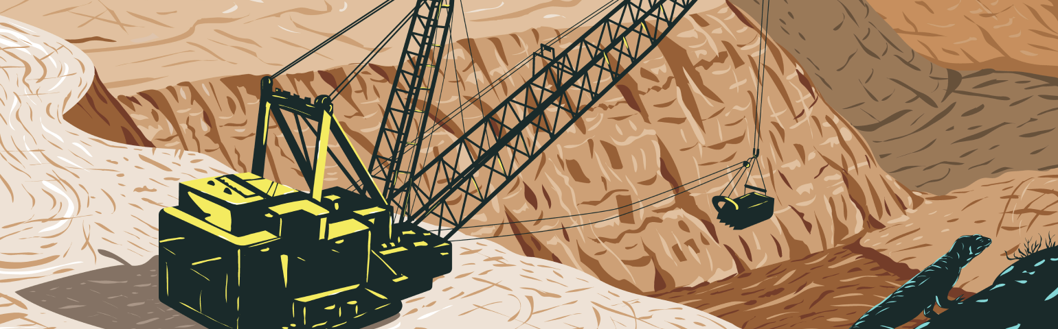 一台挖掘机坐在露天矿旁边